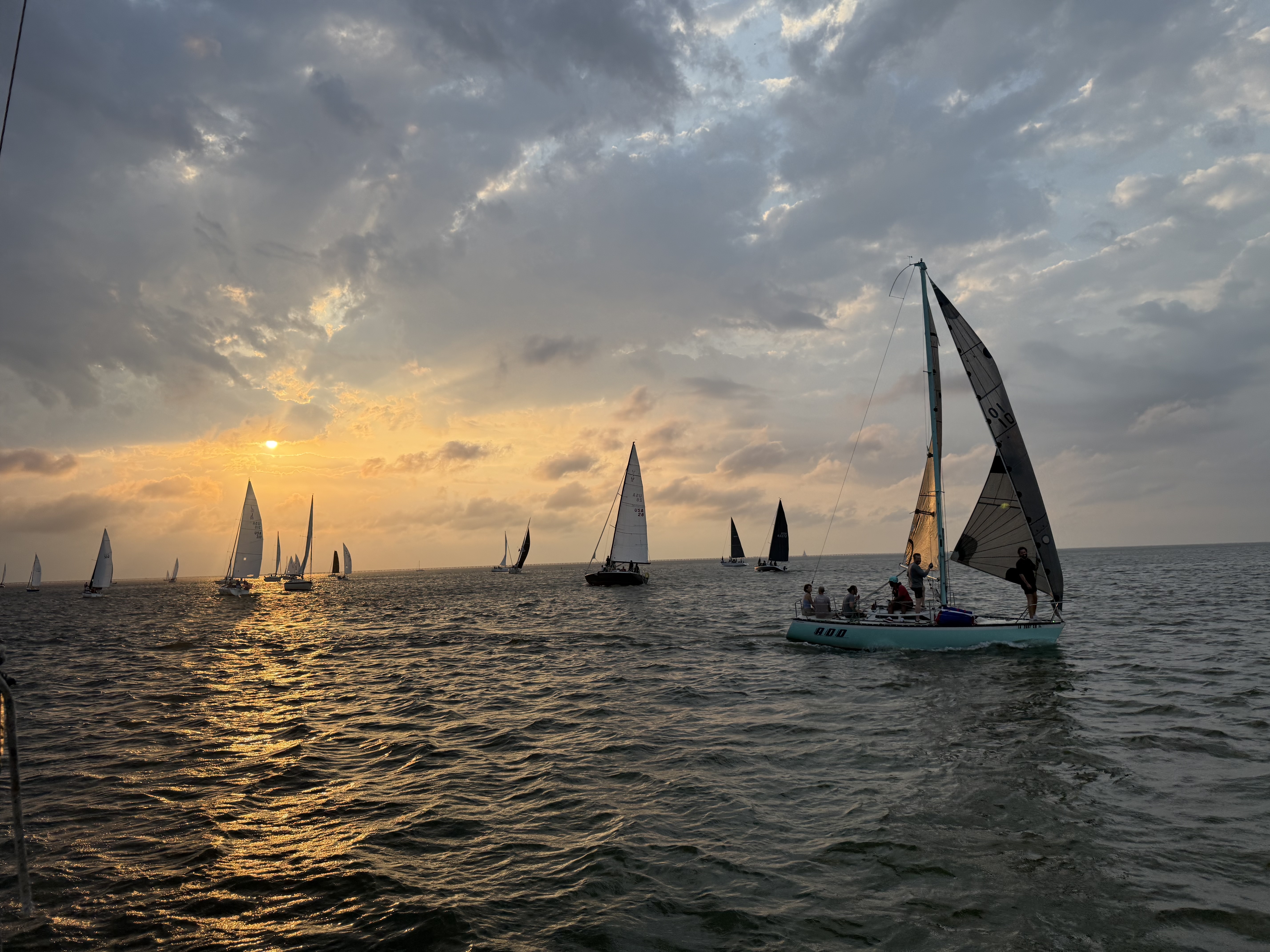 Sailboats racing at sunset on Lake Pontchartrain